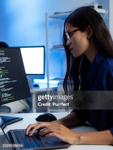 Asian Female Software Developer Working on Code Software Project in Tech Office Asian Female Software Developer Working on Code Software Project in Tech Office