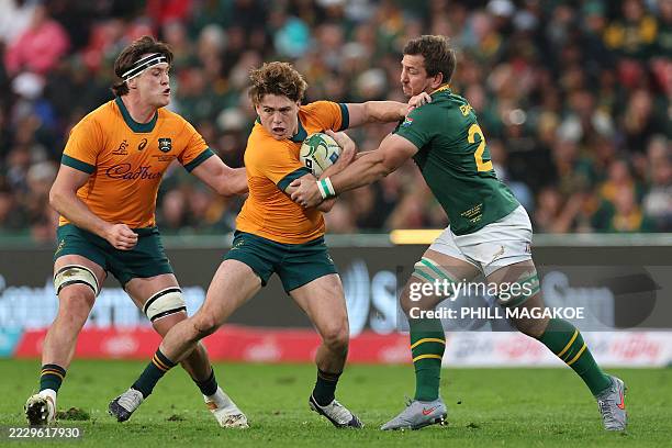 Australia's fly-half James O'Connor is tackled by South Africa's lock forward Kwagga Smith during the Rugby Championship first round Test match...