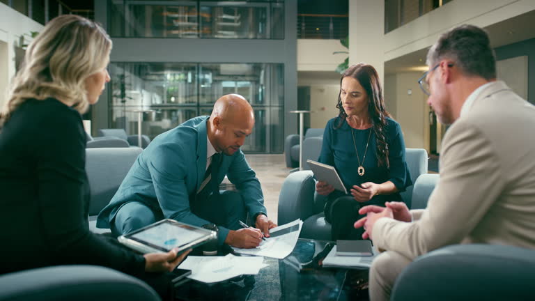 https://media.gettyimages.com/id/2229722808/video/planning-business-people-and-documents-in-hotel-for-meeting-investment-or-analysis-with.jpg?b=1&s=640x640&k=20&c=n49Lf1_46h6XwHrYsHcn-B10o0PKWbQmZ0cR5EWOHys=
