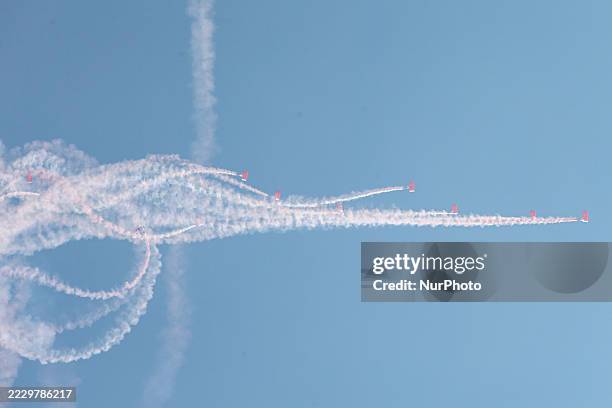 Indonesian Armed Forces soldiers perform a parachute jump at Indonesia's 80th Independence Day ceremony above the National Monument in Jakarta,...