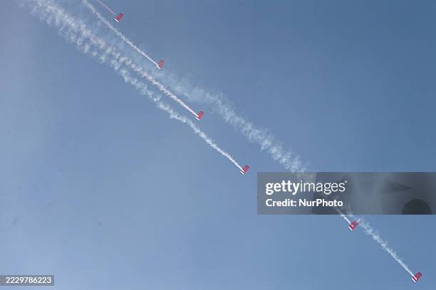 Indonesian Armed Forces soldiers perform a parachute jump at Indonesia's 80th Independence Day ceremony above the National Monument in Jakarta,...