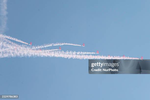 Indonesian Armed Forces soldiers perform a parachute jump at Indonesia's 80th Independence Day ceremony above the National Monument in Jakarta,...