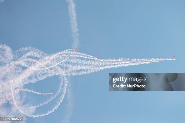 Indonesian Armed Forces soldiers perform a parachute jump at Indonesia's 80th Independence Day ceremony above the National Monument in Jakarta,...