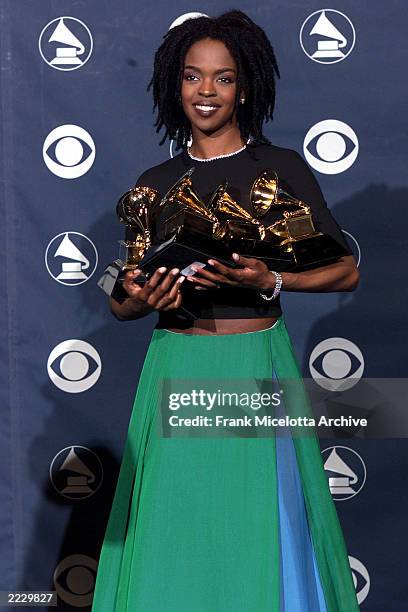 Lauren Hill holding her five Grammy Awards at the 41st Annual Grammy Awards in Los Angeles.