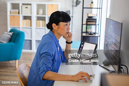 Woman developing advanced computing project at modern desk Woman developing advanced computing project at modern desk
