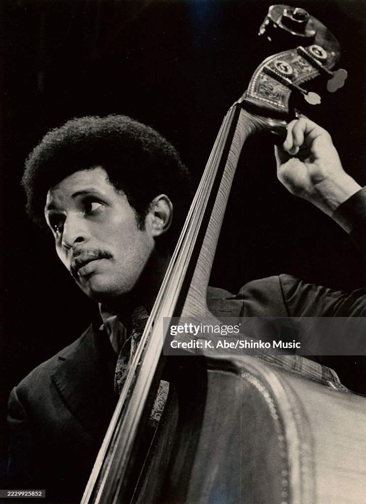 Larry Ridon A portrait of Larry Ridley tuning his bass, location unknown, circa ...