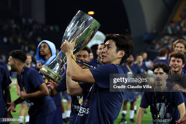 Lee Kang-In of Paris Saint-Germain celebrates with the UEFA Super Cup trophy after the team's victory in the UEFA Super Cup 2025 match between Paris...