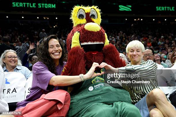 Sue Bird, mascot Doppler of the Seattle Storm and Megan Rapinoe pose during the game between the Seattle Storm and the Atlanta Dream at Climate...