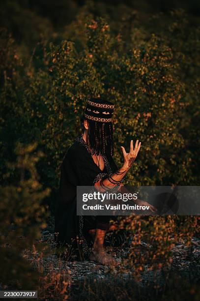 portrait photo of a shaman. mysterious man in the nature - traditional native american medicine stock pictures, royalty-free photos & images
