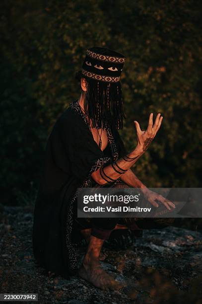 portrait photo of a shaman. mysterious man in the nature - traditional native american medicine stock pictures, royalty-free photos & images