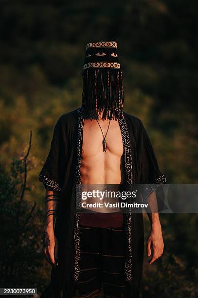 portrait photo of a shaman. mysterious man in the nature - traditional native american medicine stock pictures, royalty-free photos & images