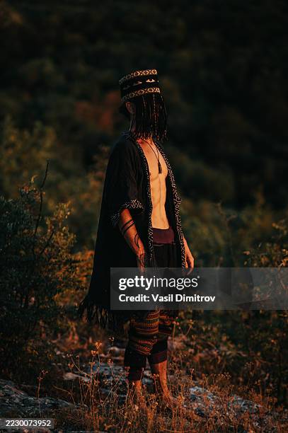 portrait photo of a shaman. mysterious man in the nature - traditional native american medicine stock pictures, royalty-free photos & images