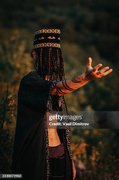 portrait photo of a shaman. mysterious man in the nature - traditional native american medicine stock pictures, royalty-free photos & images