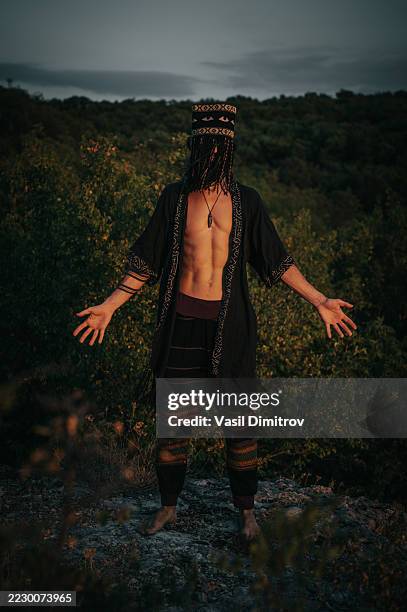 portrait photo of a shaman. mysterious man in the nature - traditional native american medicine stock pictures, royalty-free photos & images