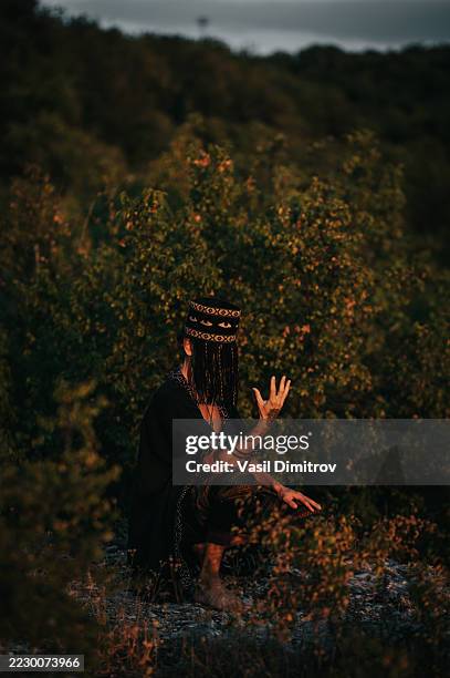 portrait photo of a shaman. mysterious man in the nature - traditional native american medicine stock pictures, royalty-free photos & images