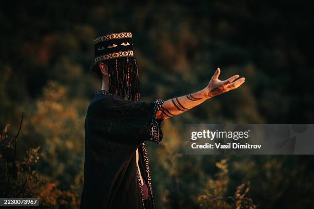 portrait photo of a shaman. mysterious man in the nature - traditional native american medicine stock pictures, royalty-free photos & images