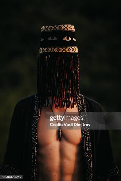 portrait photo of a shaman. mysterious man in the nature - traditional native american medicine stock pictures, royalty-free photos & images