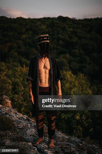 portrait photo of a shaman. mysterious man in the nature - traditional native american medicine stock pictures, royalty-free photos & images