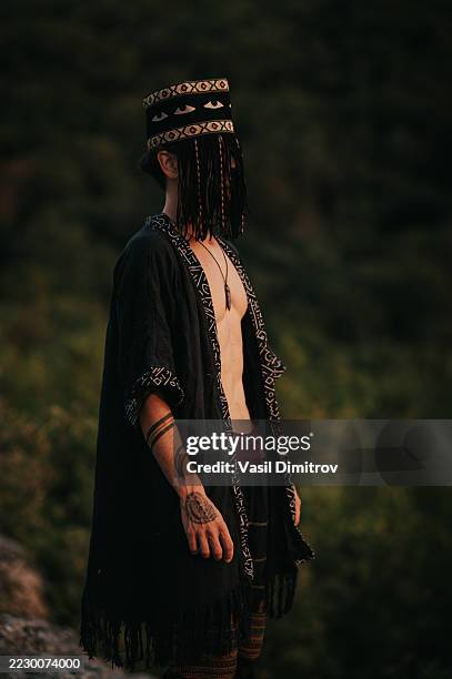 portrait photo of a shaman. mysterious man in the nature - traditional native american medicine stock pictures, royalty-free photos & images