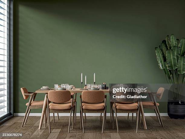 a modern but retro dining room with a full (set) table and chairs, a potted plant near a window, '70s retro style furniture - renovation of upholstered furniture stock pictures, royalty-free photos & images