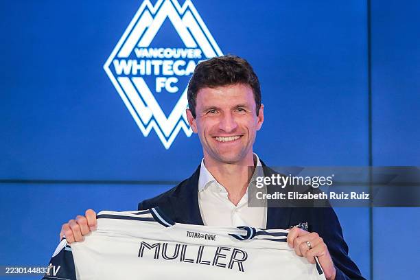 German football player Thomas Müller holds his jersey as he was introduced by the Vancouver Whitecaps during a press conference at TELUS Garden on...