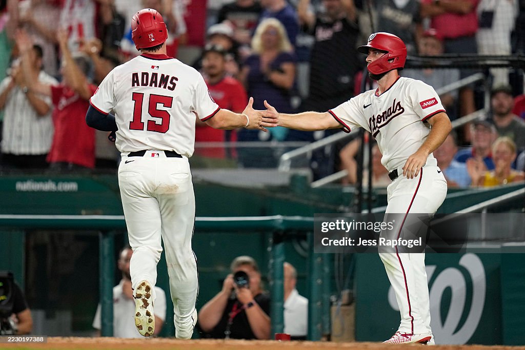 Nationals Riley Adams Riley Adams of the Washington Nationals high fives Paul DeJong of the ...