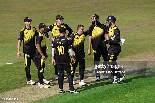 Graeme van Buuren of Gloucestershire celebrates with team-mates after taking the wicket of Eddie Byrom of Glamorgan, caught by Tommy Boorman during...