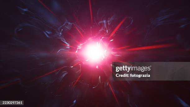 red energy explosion with light rays - light vortex stock pictures, royalty-free photos & images