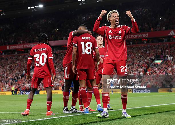 Hugo Ekitike of Liverpool celebrates his team's second goal scored by teammate Cody Gakpo during the Premier League match between Liverpool and...