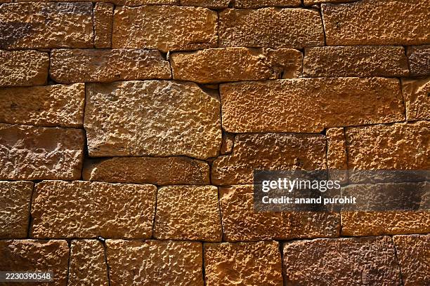 distinctive yellow sandstone walls, jaisalmer fort, rajasthan, india - historic building stock pictures, royalty-free photos & images