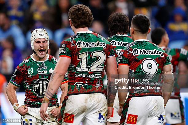 Jye Gray of the Rabbitohs celebrates with team mates after winning