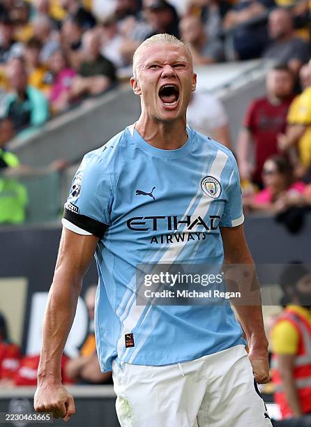 Erling Haaland of Manchester City celebrates scoring his team's third goal during the Premier League match between Wolverhampton Wanderers and...