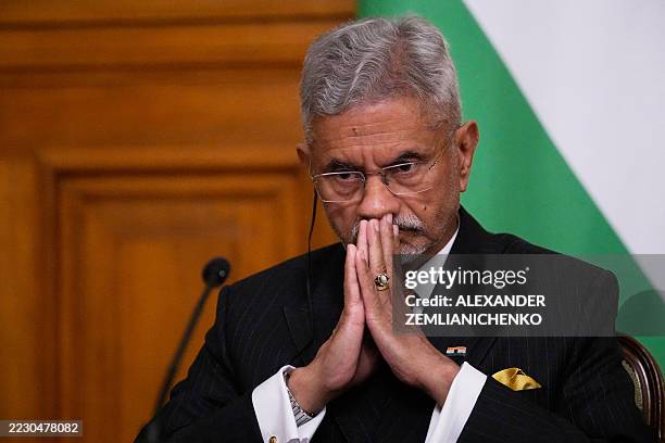 India's Foreign Minister Subrahmanyam Jaishankar joins hands as he attends a joint news conference with Russia's Foreign Minister during their...