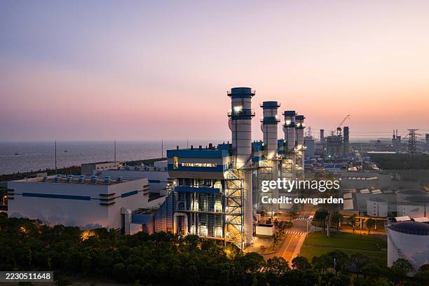 aerial view of natural gas fired electrical power plant at sunset - electricity substation stock pictures, royalty-free photos & images