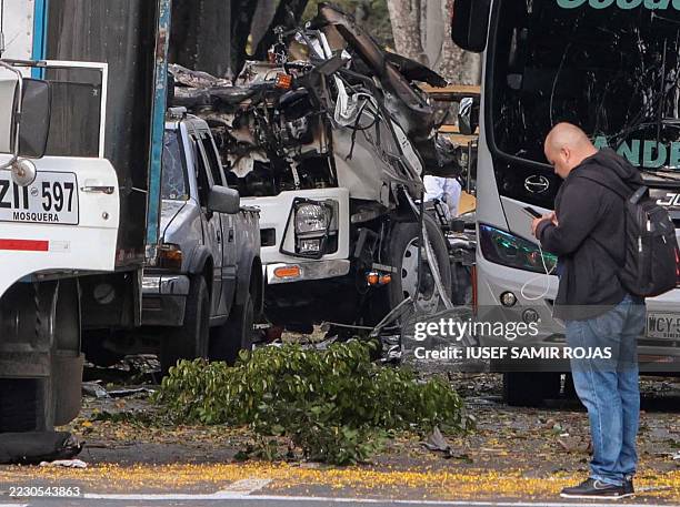Members of the Colombian police inspect the area of a bomb explosion in Cali, Colombia on August 21 2025. Five people were killed and dozens were...
