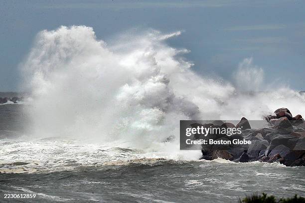 Narragansett, RI A huge wave crashes into a breakwater at Camp Cronin in Point Judith as an angry ocean from the effects of Hurricane Erin churns up...