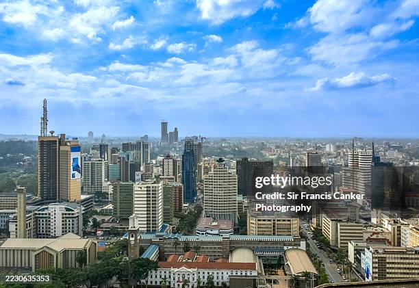 aerial skyline of nairobi with prominent skyscrapers of the city's financial center, offices and also national and local government buildings (nairobi town hall) under romantic african sky in nairobi, kenya, africa - kenyan culture stock pictures, royalty-free photos & images