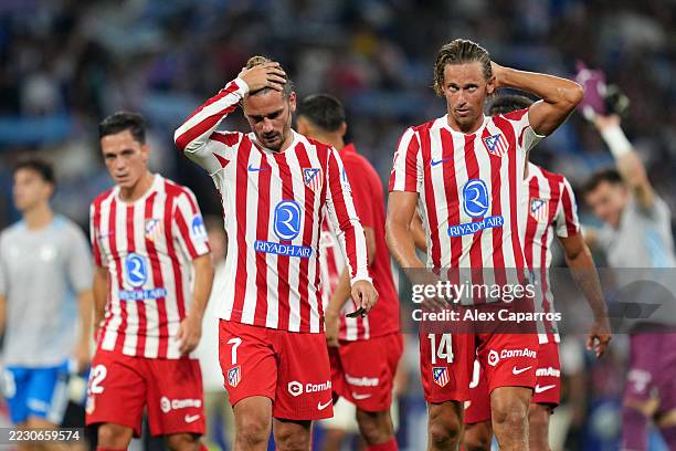 Antoine Griezmann and Marcos Llorente of Atletico de Madrid look dejected following the team's defeat in the LaLiga EA Sports match between RCD...