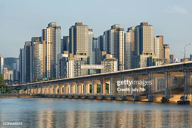 seoul han river bridge and gangnam apartments - han river stock pictures, royalty-free photos & images