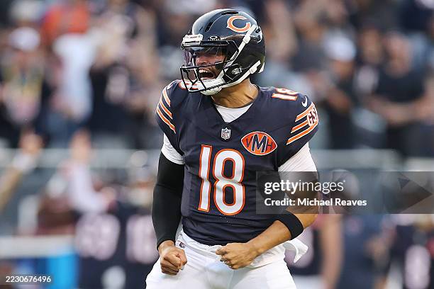 Caleb Williams of the Chicago Bears celebrates a 36-yard touchdown pass to Olamide Zaccheaus against the Buffalo Bills during the NFL Preseason 2025...