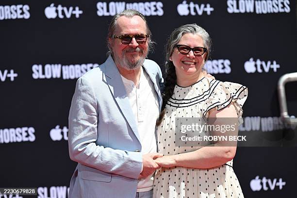 English actor Gary Oldman poses with his wife, Canadian writer Gisele Schmidt, during his hand and footprint ceremony at the TCL Chinese Theatre...