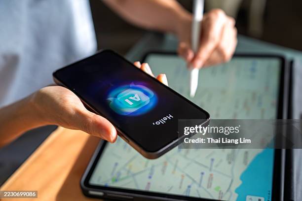 planning trip with ai chatbot on smartphone - turismo imagens e fotografias de stock
