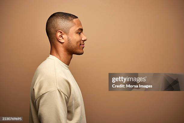 side view of smiling young man - profile view stock pictures, royalty-free photos & images