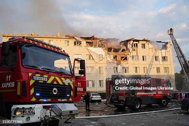 Firefighters extinguish a fire in the destroyed apartment building after the Russian drone attack on August 18, 2025 in Kharkiv, Ukraine. In the...