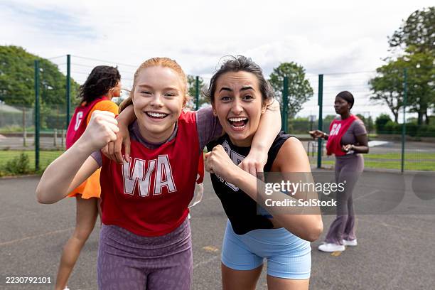 winning together is better - netball stock pictures, royalty-free photos & images