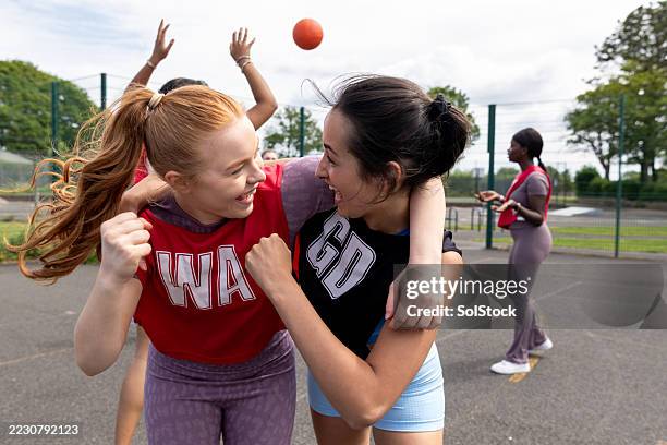 celebrating sport success - netball stock pictures, royalty-free photos & images
