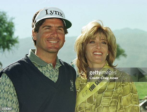 Fred Couples poses for a picture with girlfriend Tawnya Dodd after winning the 1996 Skins Game competition held at the Rancho La Quinta Country Club...