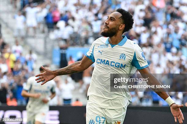 Marseille's Gabonese forward Pierre-Emerick Aubameyang celebrates scoring his team's third goal during the French L1 football match between Olympique...
