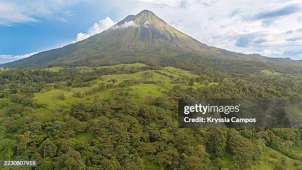 arenal volcano at sunset in costa rica - arenal volcano national park stock pictures, royalty-free photos & images