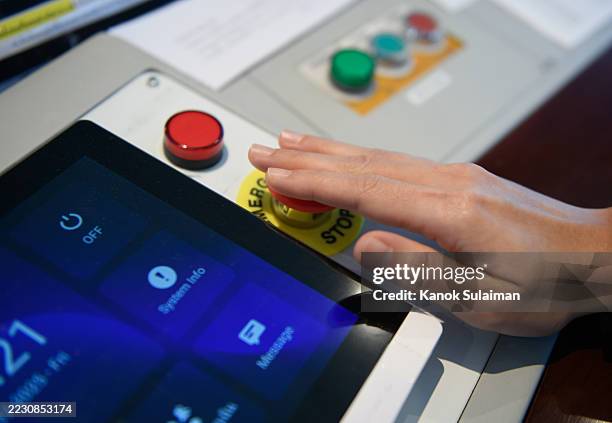 a woman pressing an emergency alarm button - air-traffic-control-system-command-center stock pictures, royalty-free photos & images